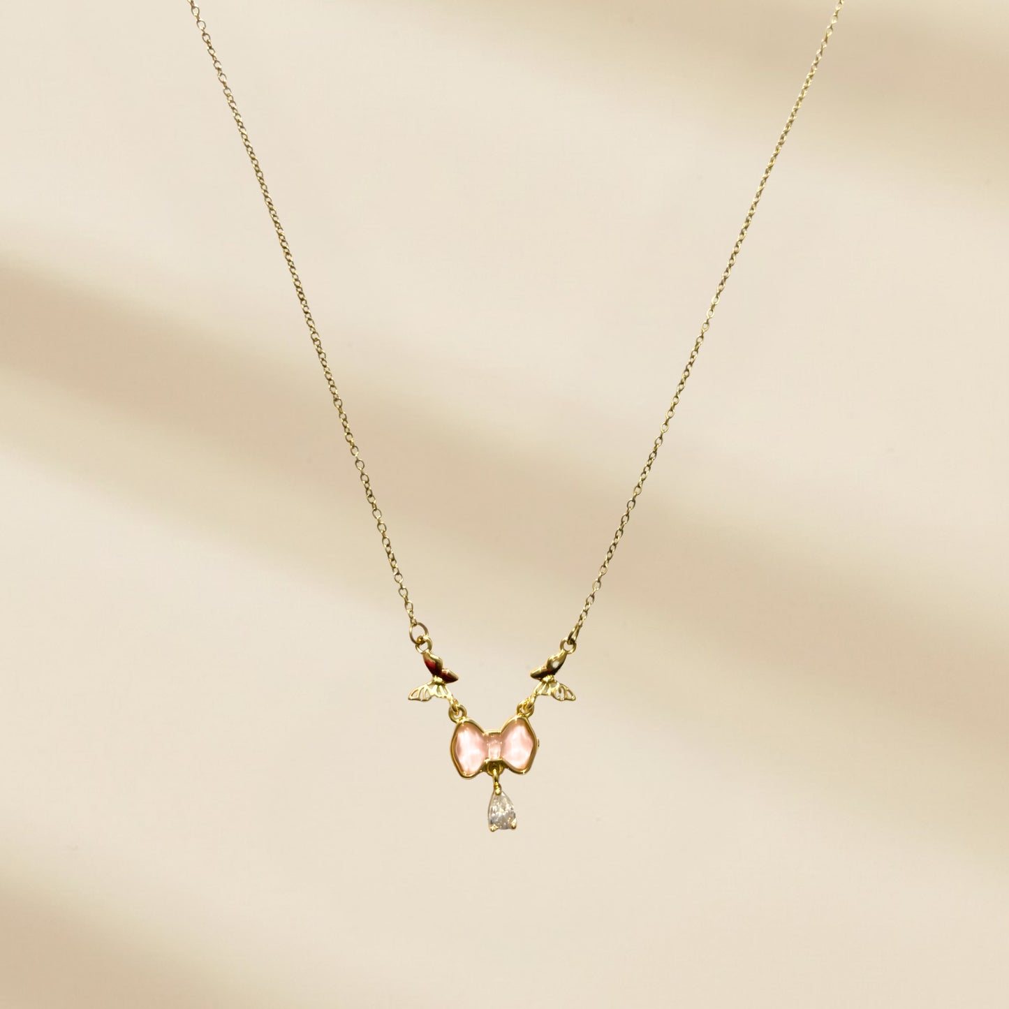 Gold plated anti tarnish bow themed pendant