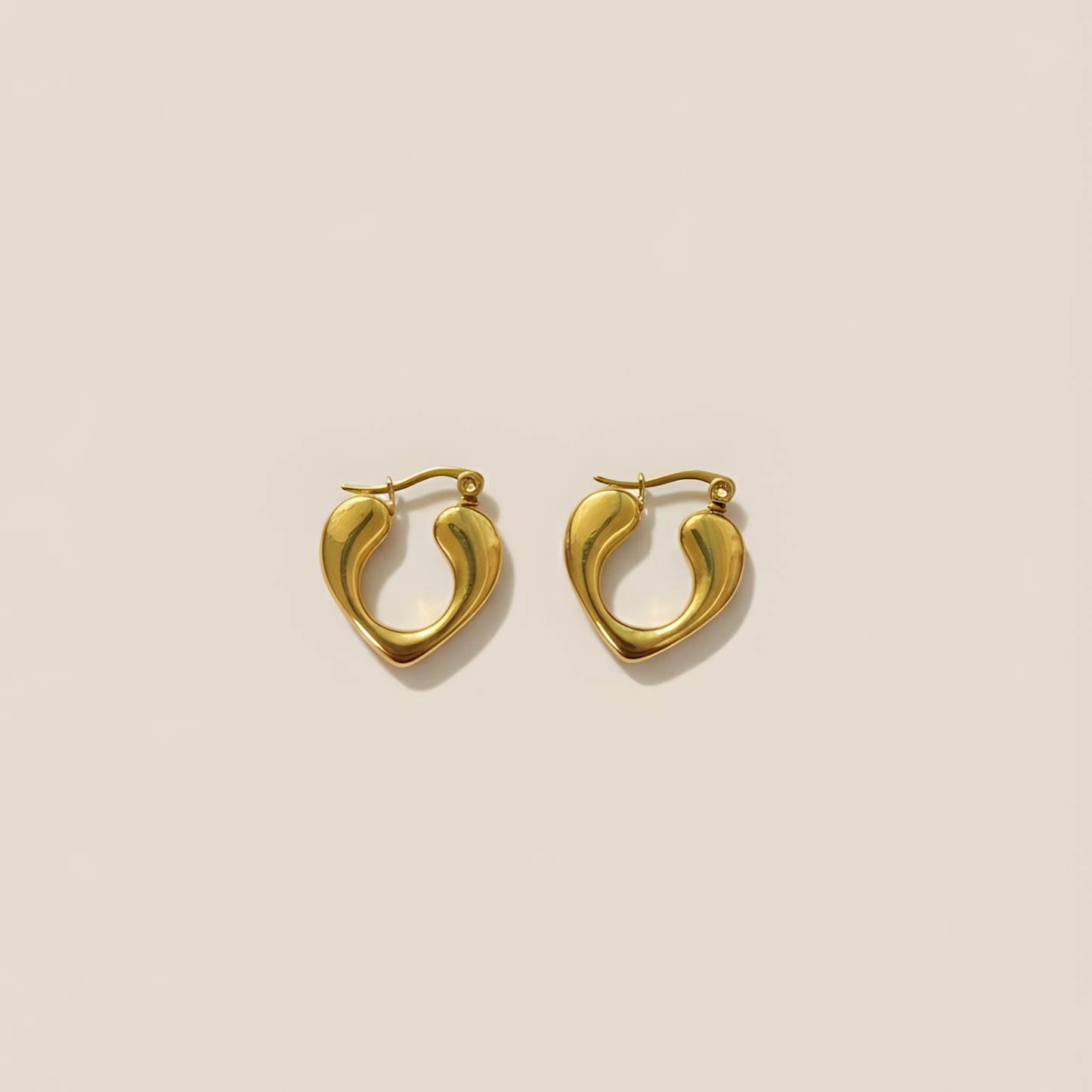 Gold plated heart themed hoop earrings