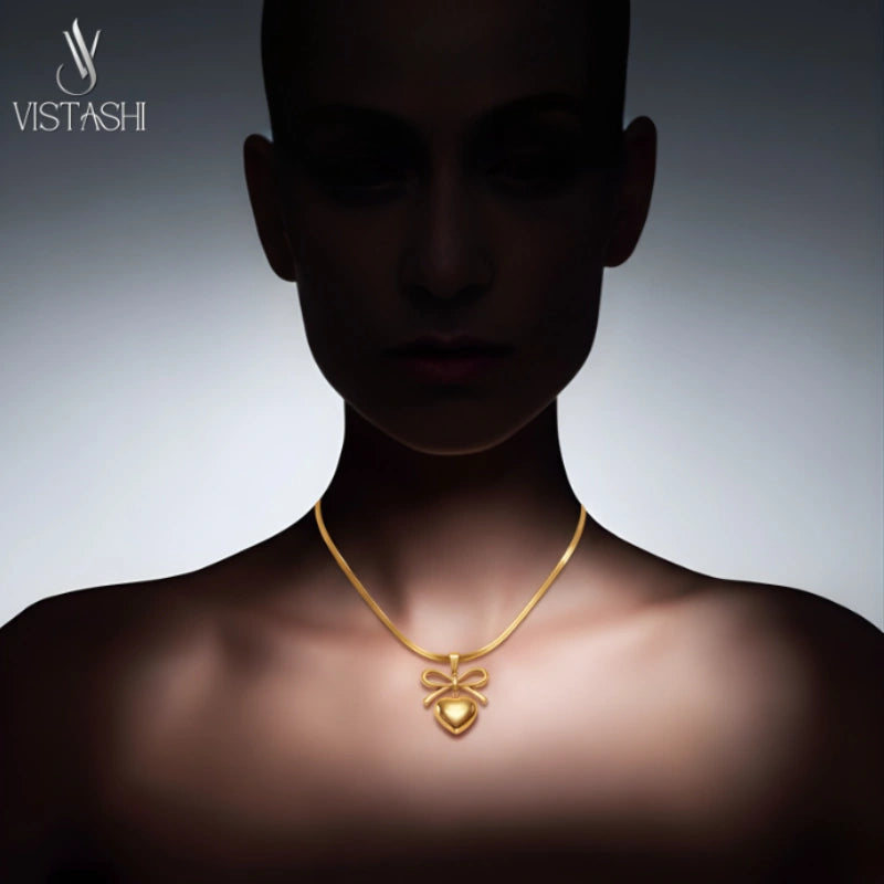 Bow with Heart Pendant