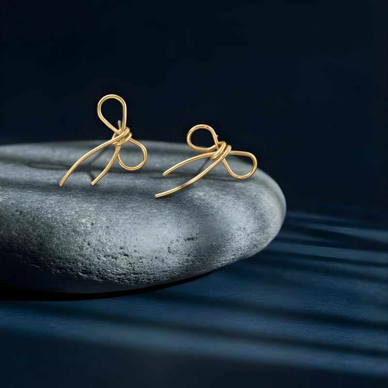 bow themed earrings